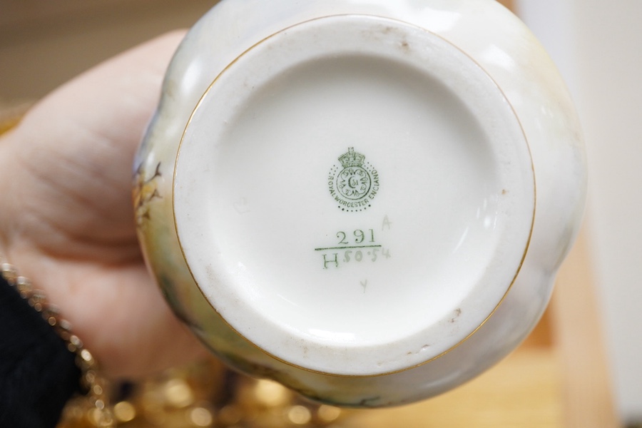 A Royal Worcester peacock painted jar and cover and a Bohemian blue glass decanter and six glasses, with gilt and enamel decoration, decanter 26cm high including stopper. Condition - finial to Worcester pot cover chipped